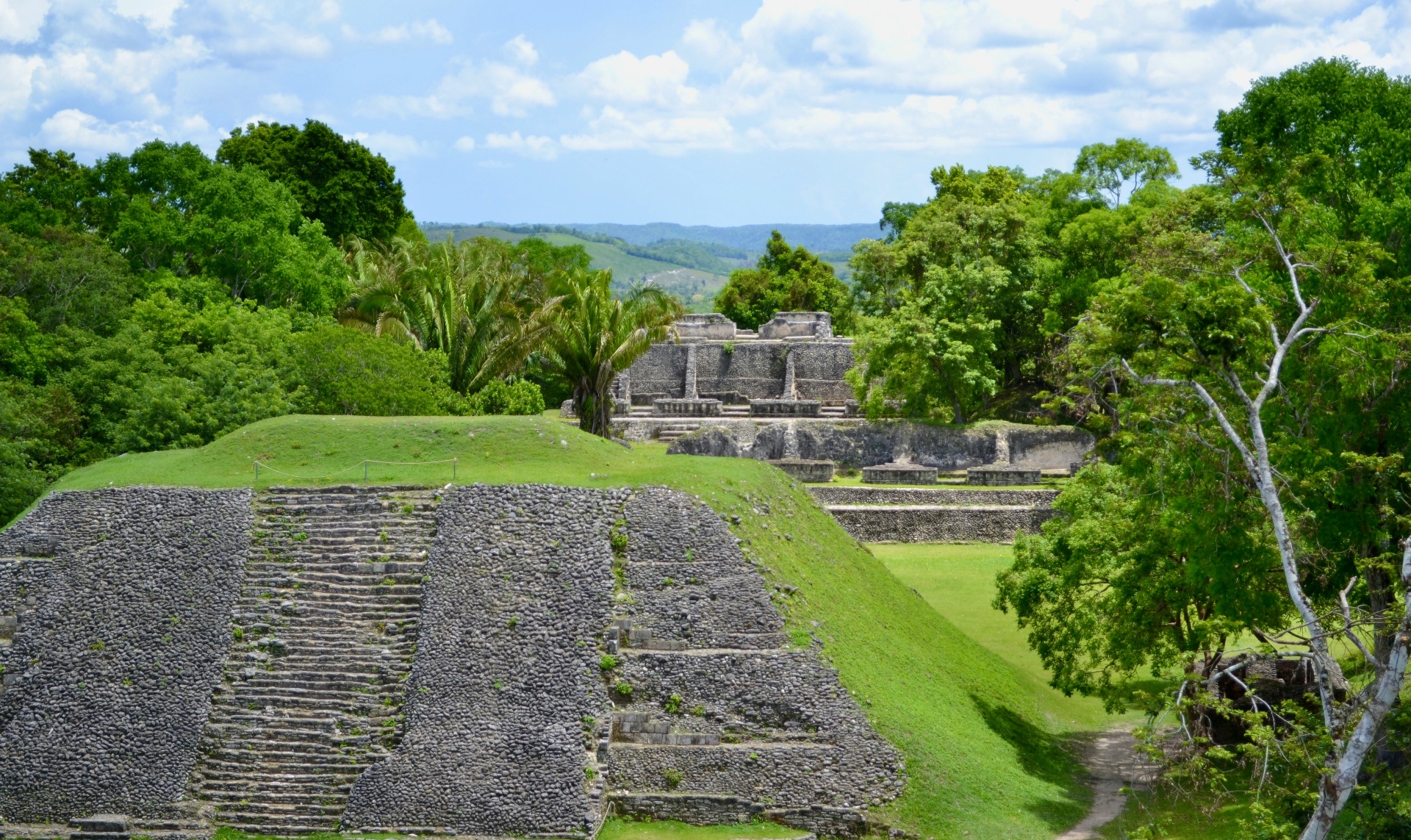 Aerial view of Maya ruins surrounded by jungle