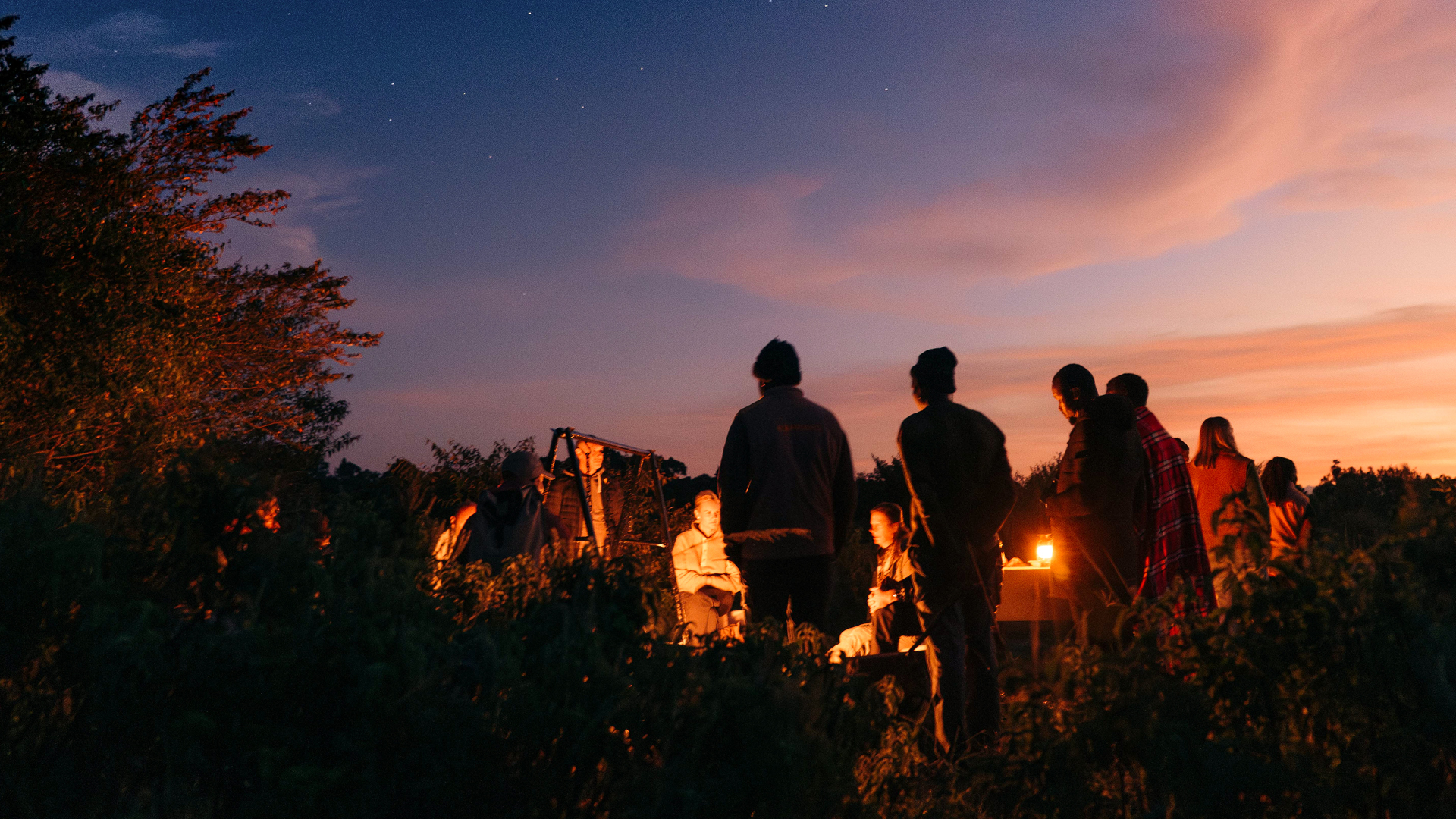 Guests around the evening campfire