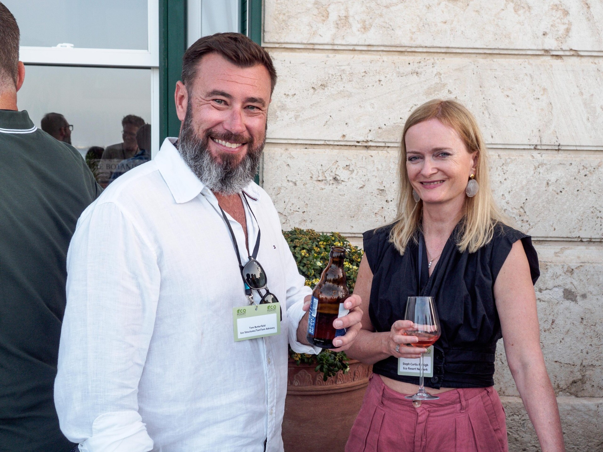 Two ERN delegates in conversation with branded lanyards