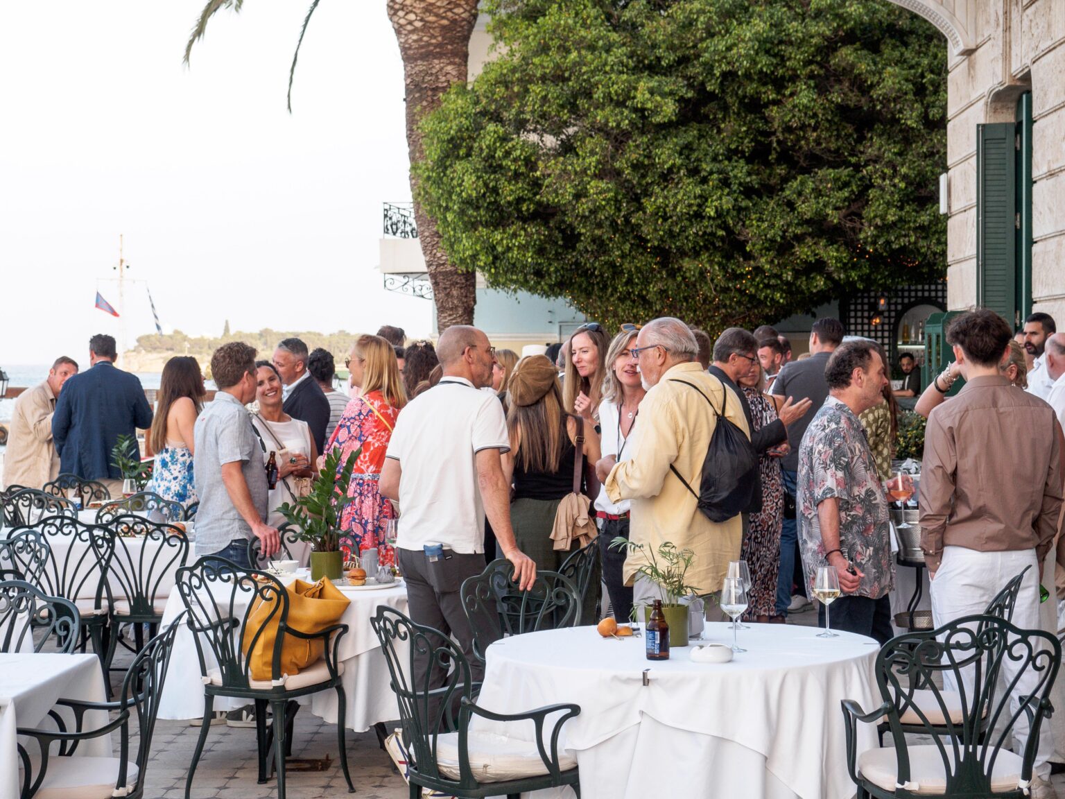 Delegates networking on the seaside terrace at ERN