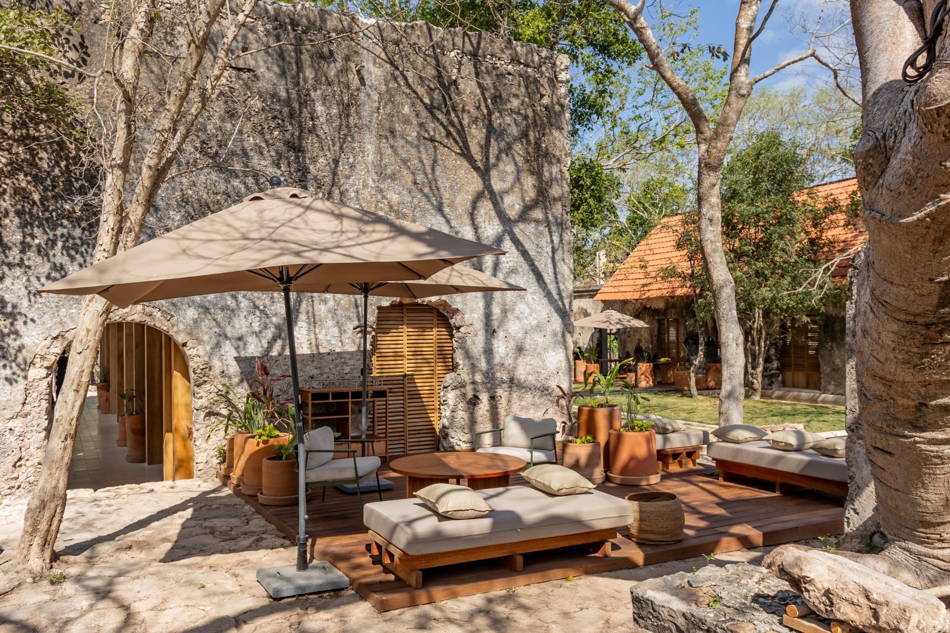 The restored courtyard where meals are served — stone walls that carry the estate's history into every dinner.